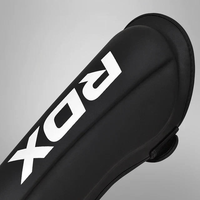 RDX Espinilleras con Empeine Negro/Blanco, T1
