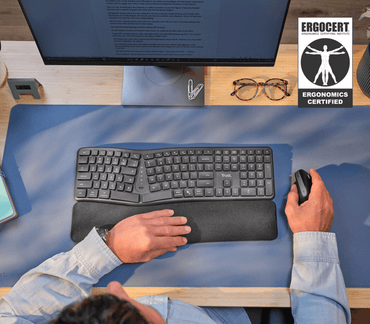 Vista superior del teclado Trust Keyra con diseño dividido y curva convexa
